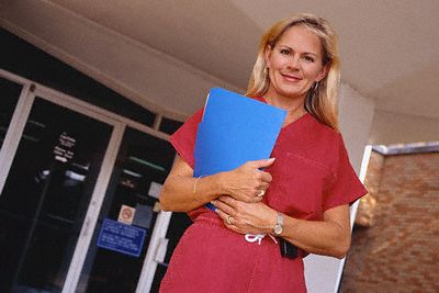 Nurse Holding File Folder